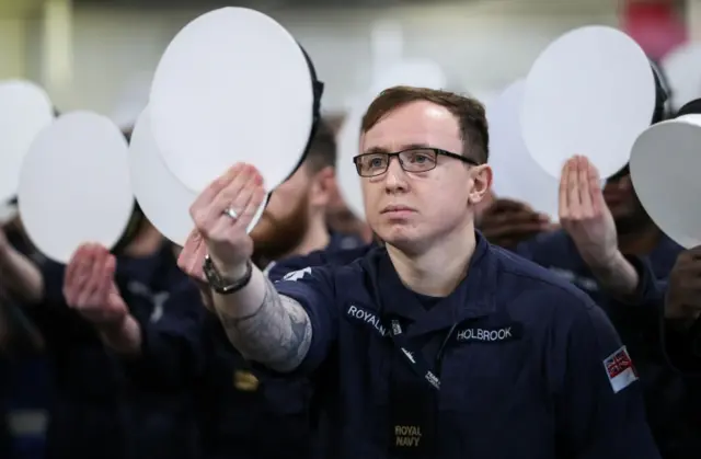 Royal Navy ratings practise in the hanger of HMS Queen Elizabeth