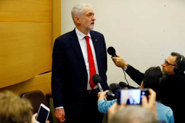 Jeremy Corbyn talking to reporters in Geneva