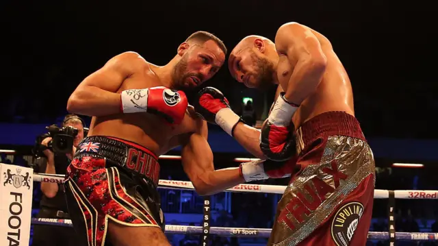 James DeGale and Caleb Truax aim punches at each other