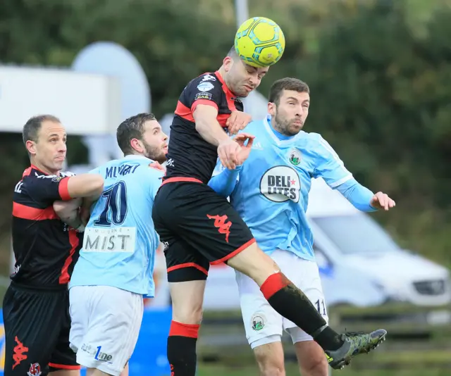 A familiar sight - Crues captain Colin Coates is first to the high ball