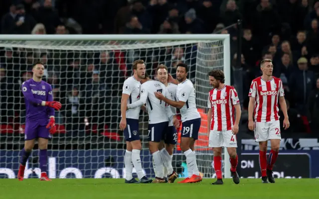 Eriksen celebrates with the team after scoring their fifth goal