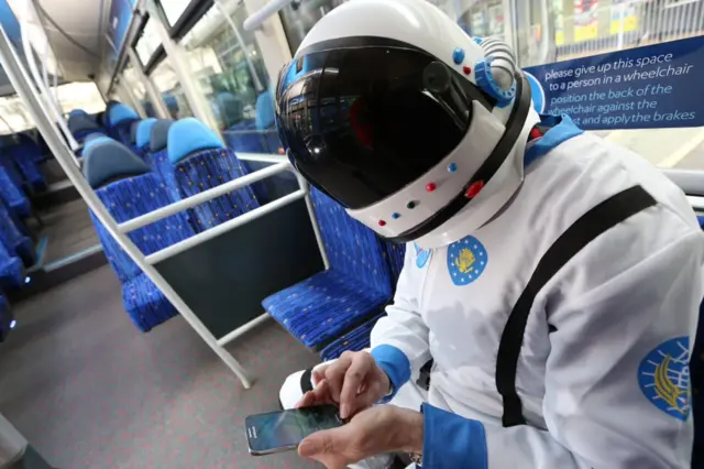 Spaceman on bus