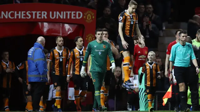 The players come out at Old Trafford