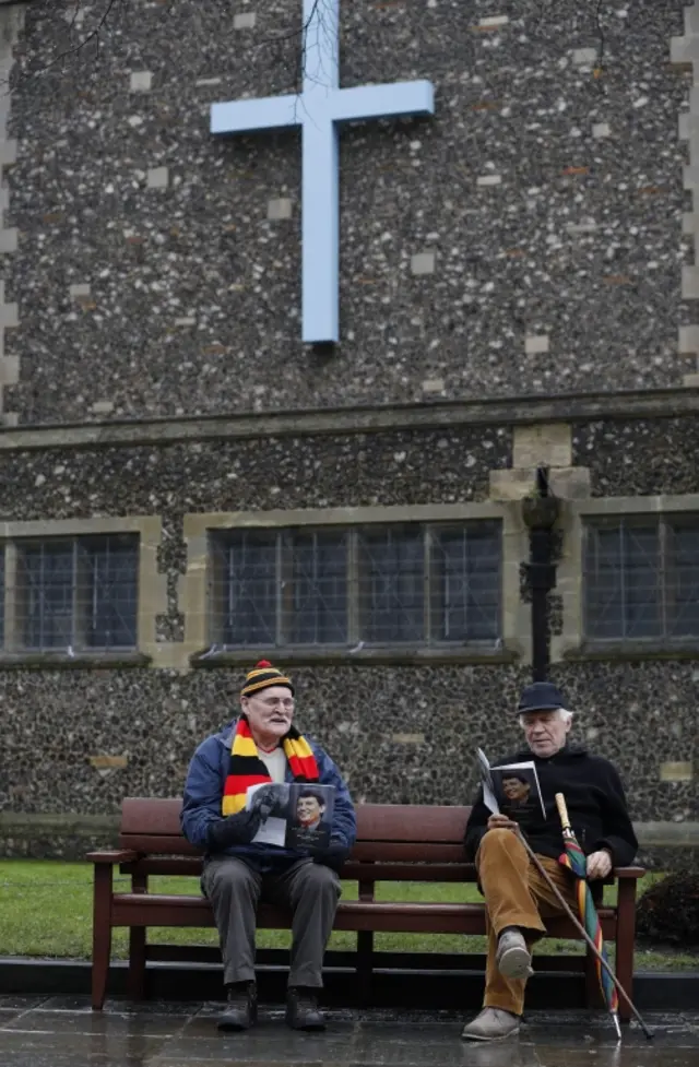 Mourners outside church