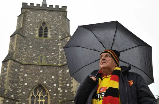 Fan outside church