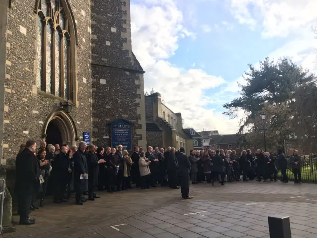 Mourners outside St Mary's church Watford