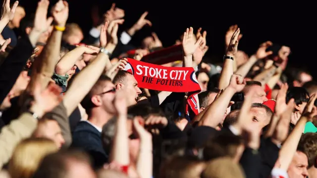 A Stoke City scarf is held in the crowd during an FA Cup match