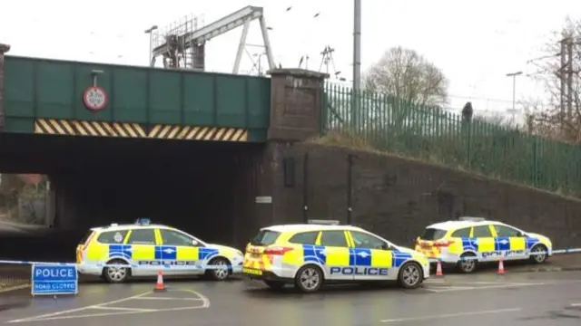 Police cars blocking road