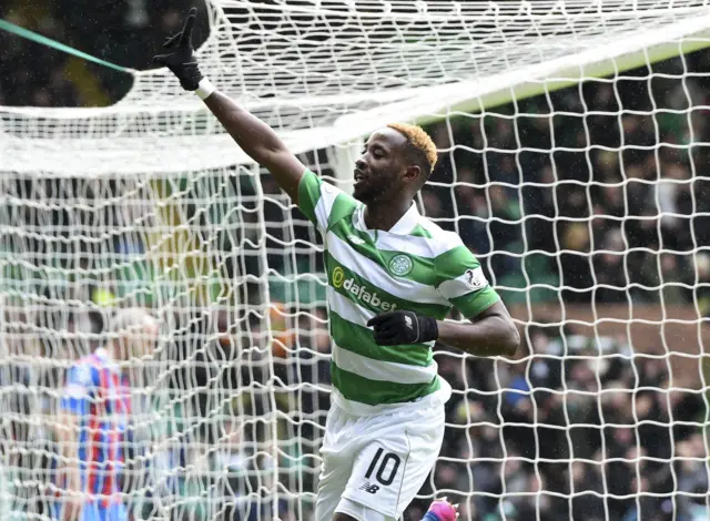 Moussa Dembele celebrates his hat-trick