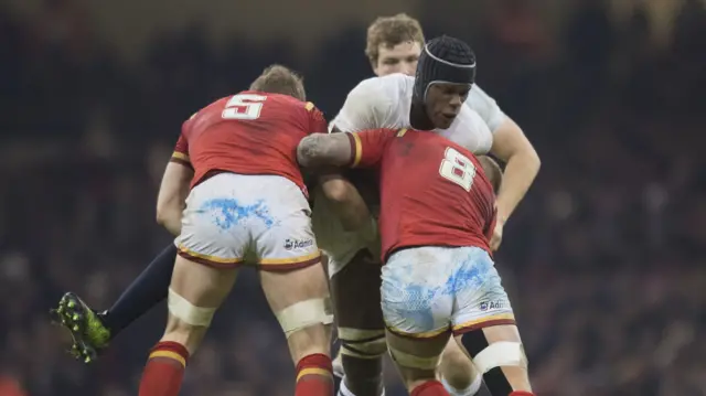 Maro Itoje is tackled