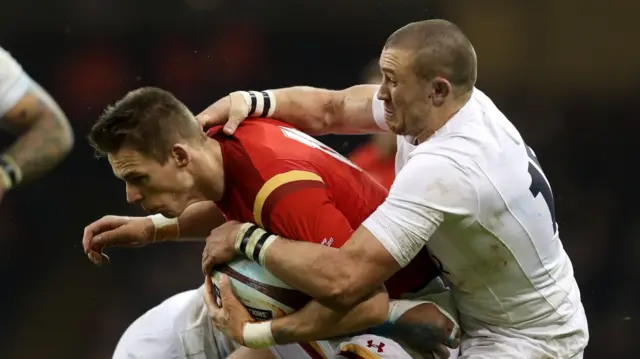 Liam Williams is tackled by Mike Brown