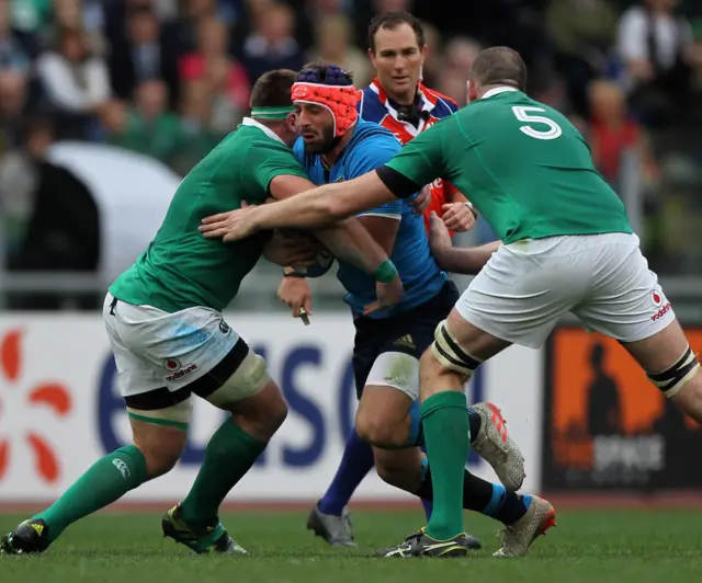 Angelo Esposito of Italy is tackled