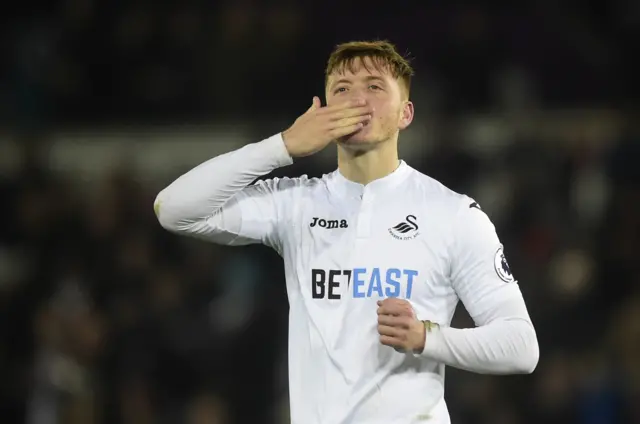 Alfie Mawson celebrates after the match