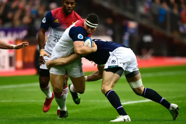 France's Guilhem Guirado is tackled