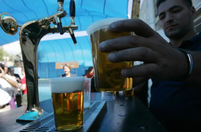 Man pulling pint