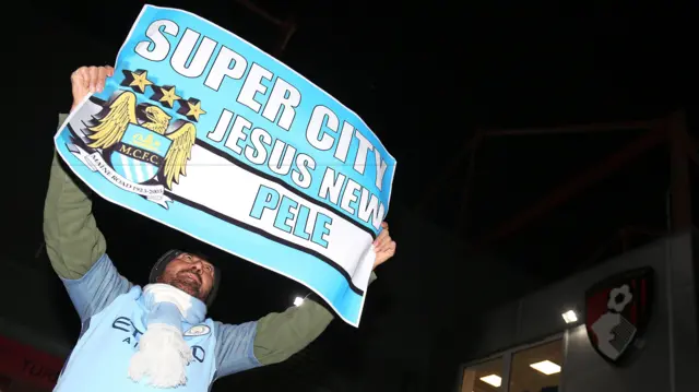 A city fan with a Jesus sign