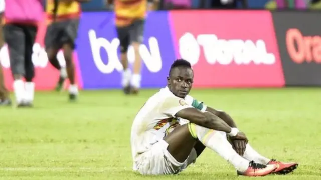 Sadio Mane sits on the pitch after missing a penalty to put Senegal out of Afcon 2017