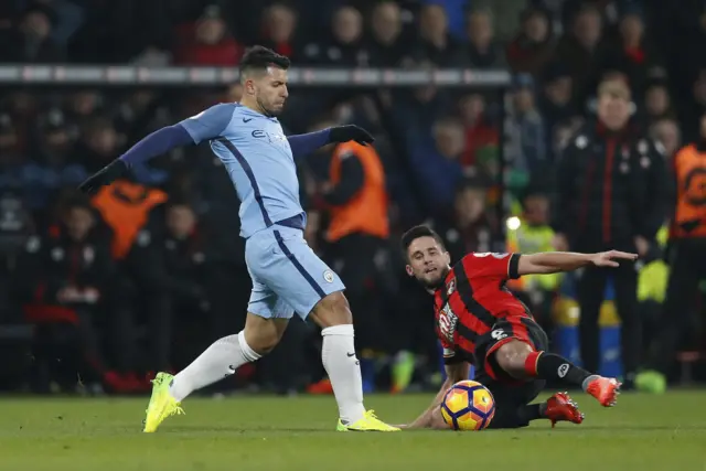 Manchester City"s Sergio Aguero in action with Bournemouth"s Andrew Surman