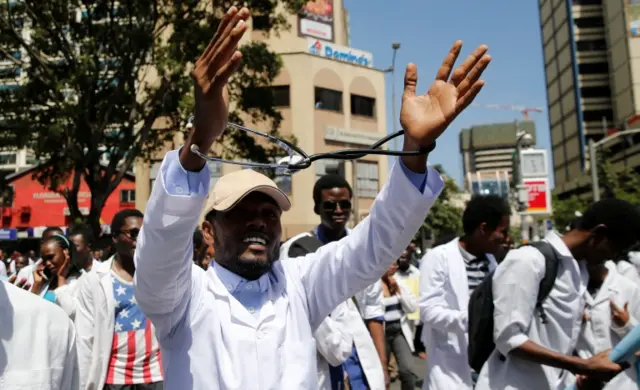 A Kenyan student doctor shouts slogans as he participates in a strike to demand fulfilment of a 2013 agreement between doctors" union and the government that would raise the medical practitioners pay and improve working conditions in Nairobi, Kenya, January 19, 2017.