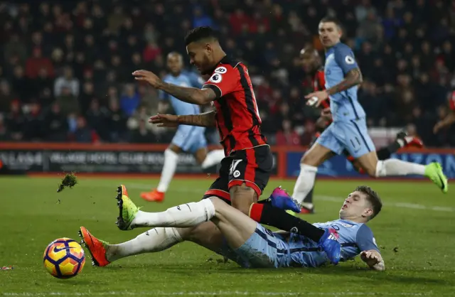 Bournemouth"s Joshua King is tackled by Manchester City"s John Stones