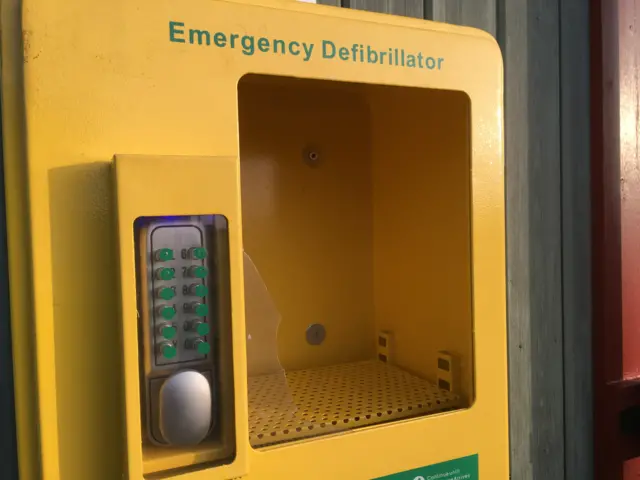 The broken box, with smashed glass, which housed the defibrillator