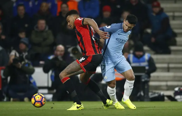 Bournemouth"s Tyrone Mings in action with Manchester City"s Sergio Aguero