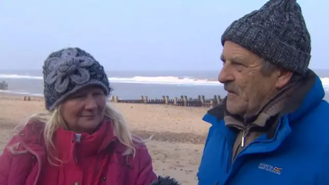 Mary and Nigel Green, in windproof coats and fleeces, wearing hats