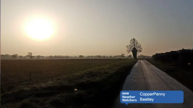 Early morning sunrise over country lane