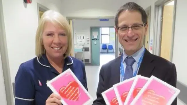 Nurse and doctor with cards