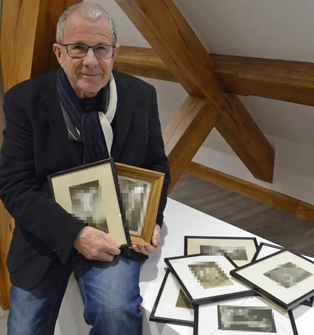 Exhibition organiser Martin Nee with some of the withdrawn artwork