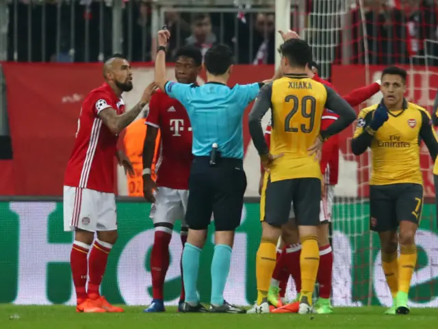 Referee Milorad Mazic awards a penalty