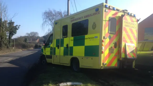 Damaged ambulance at scene of crash