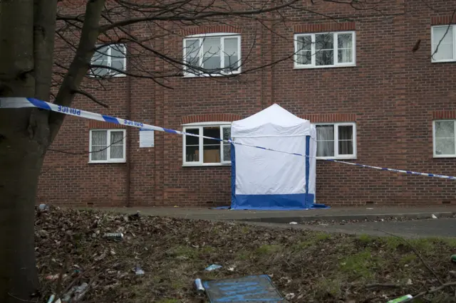 White forensic tent at the scene of the murder