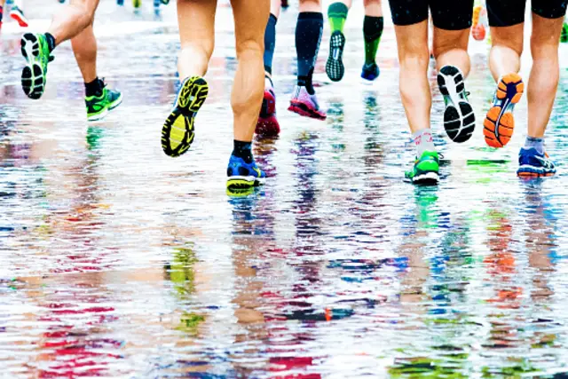 Marathon runners on wet surface