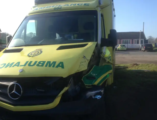 Damaged ambulance at scene of crash