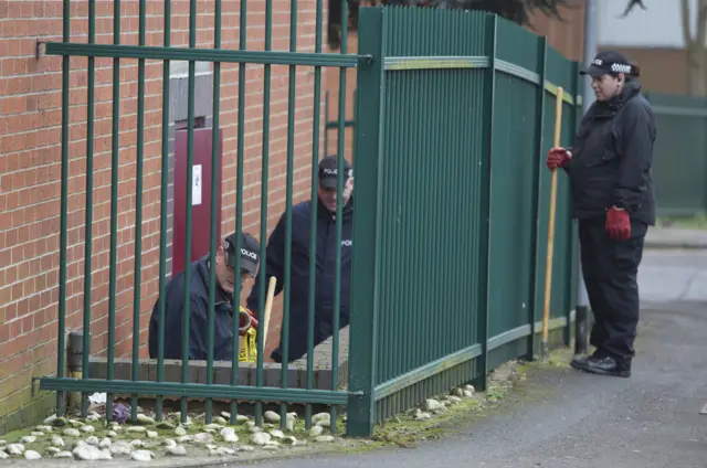 Northamptonshire Police search the scene at St. George's Street