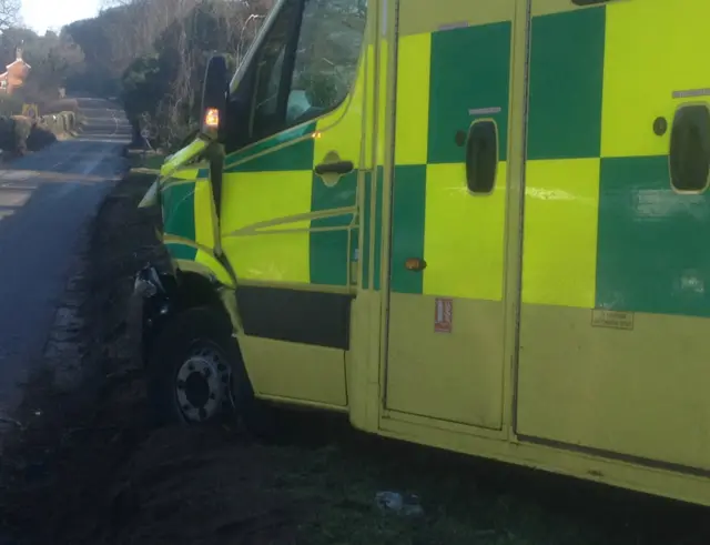 Damaged ambulance at scene of crash