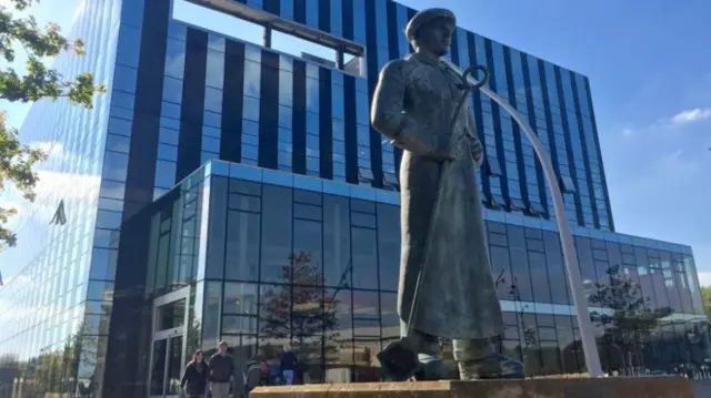 Statue of a steelworker outside the Cube building in Corby.