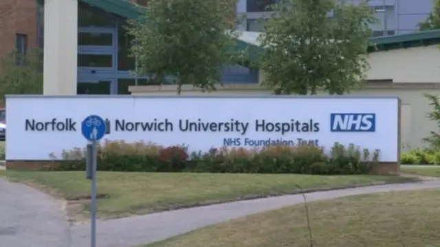 Norfolk & Norwich University Hospital sign at entrance to the hospital