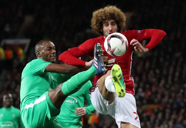 Marouane Fellaini fights for the ball