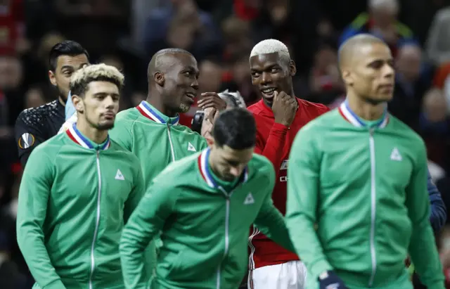 The Pogba brothers share a joke before the match