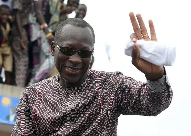 Presidential candidate and leader of coalition of the opposition Patrice Talon waves to supporters during a campaign rally in the Ekpe district near Cotonou, in Benin, on March 18, 2016.