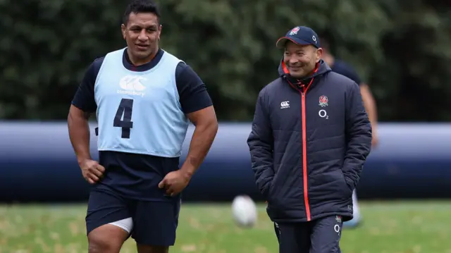 Eddie Jones,(R) the England head coach talks to Mako Vunipola during the England training session