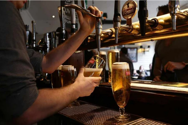 Barman pouring drinks