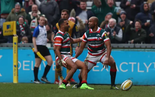 JP Pietersen of Leicester Tigers is congratulated on his first try, by Telusa Veainu