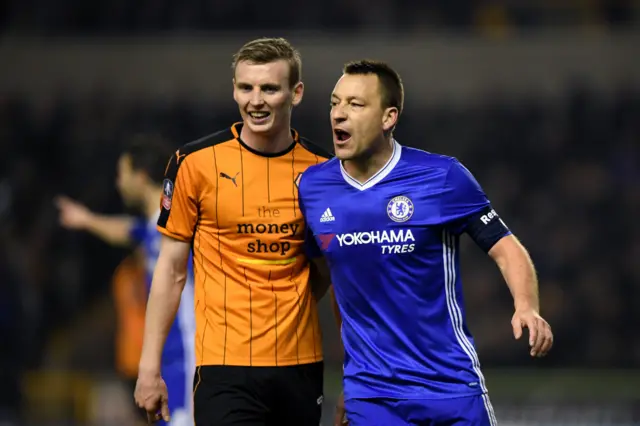 Jon Dadi Bodvarsson of Wolves (L) and John Terry of Chelsea