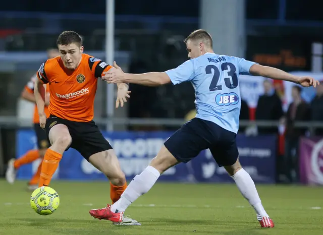 Carrick's Sean Noble attempts to skip past Leroy Millar of Ballymena United