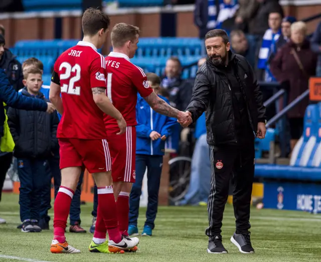 Aberdeen manager Derek McInnes (right) congratulates his players