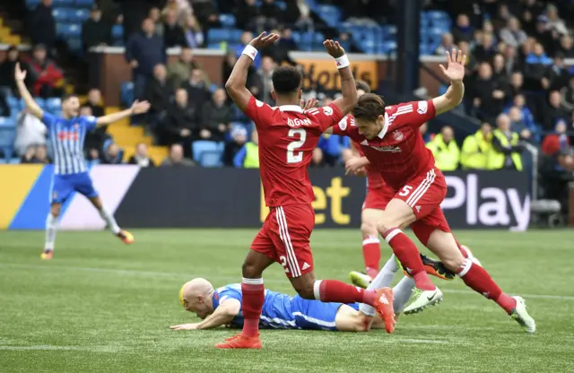 Conor Sammon goes down under Ash Taylor's challenge