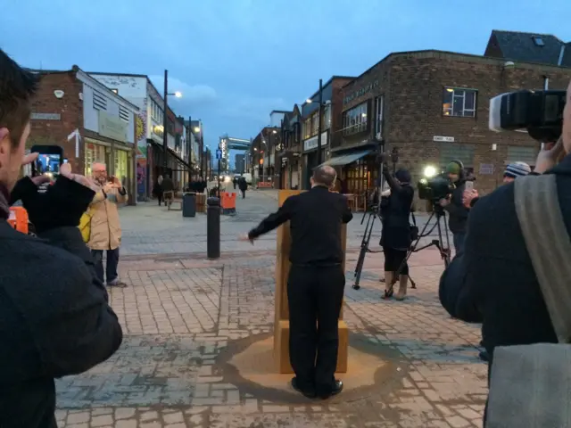 Person speaking into microphone at top of Humber Street